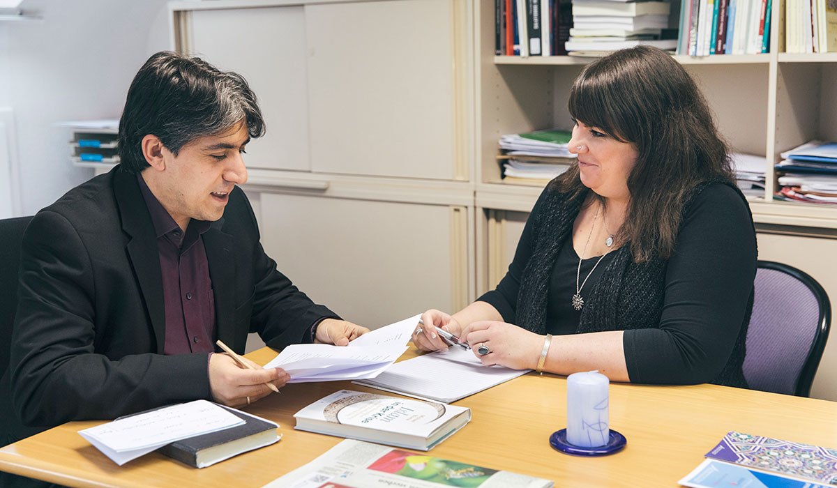 The team discusses research or new challenges during regular meetings.