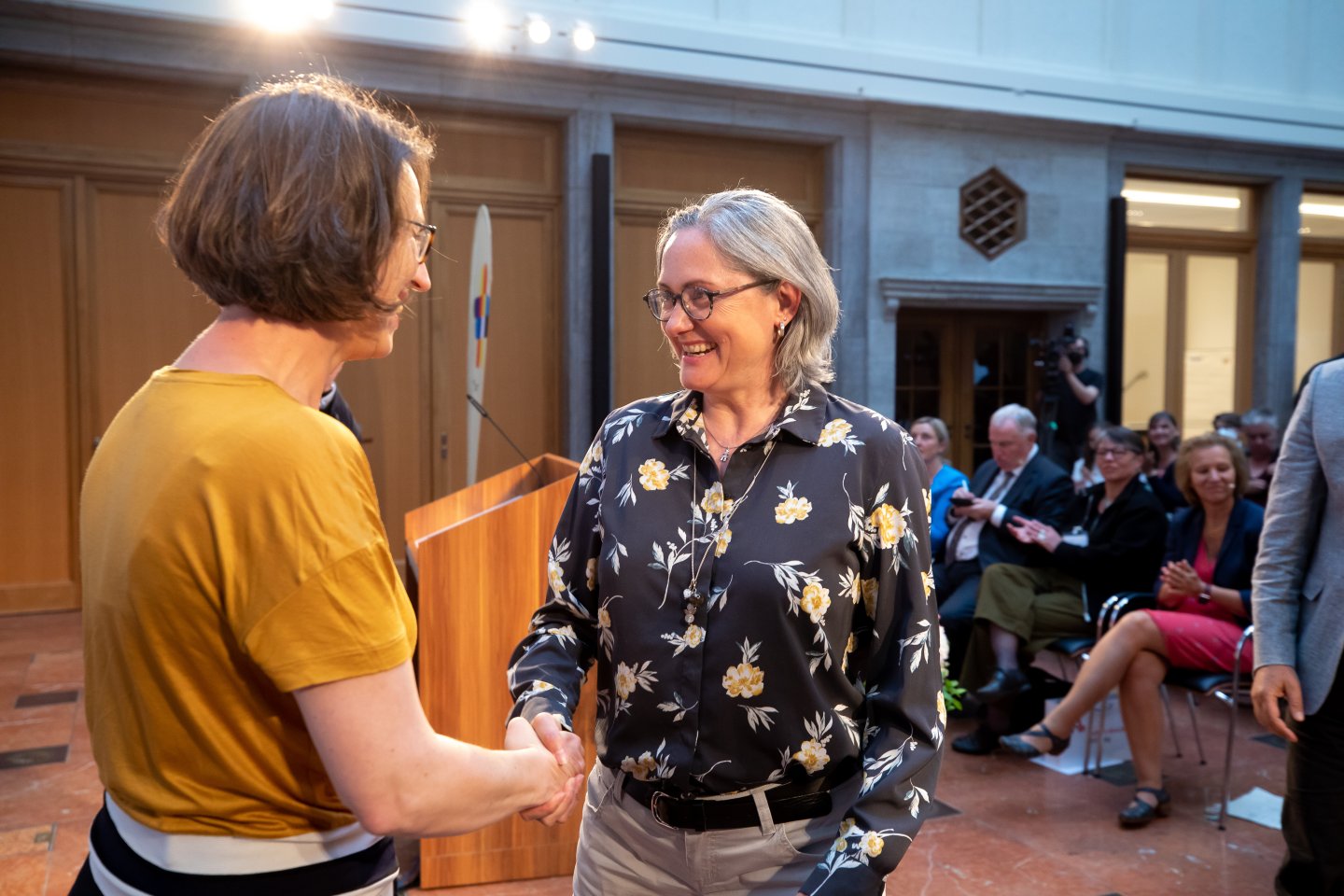 Shaking hands with representatives of the selected Common Ground regions